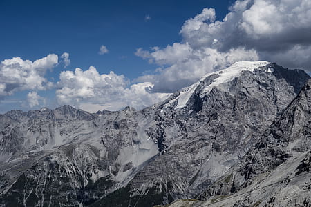 snow capped mountain under cloudy sky thumbnail