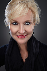 blonde haired red lips woman wearing black scarf thumbnail