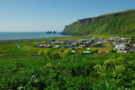 high angle photo of mountain and houses thumbnail