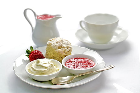 white ceramic plate and saucer with soup, strawberry and bread thumbnail