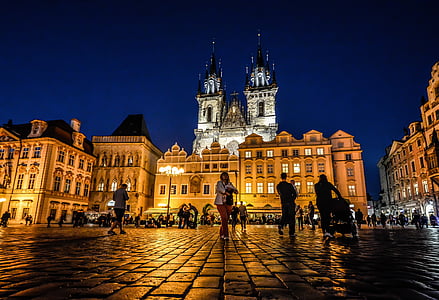 group of people walking on pathway in front of building thumbnail