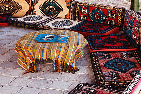 blue and white poster on brown tablecloth thumbnail