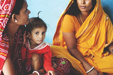 girl sitting between two women talking thumbnail