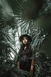 woman under green leafed plant thumbnail