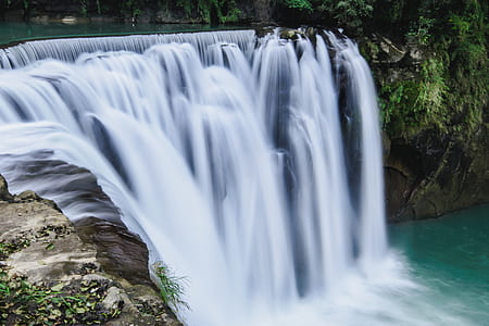 timelapse photography of flowing multi-tier waterfalls thumbnail