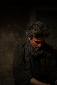 man wearing grey knit scarf thumbnail