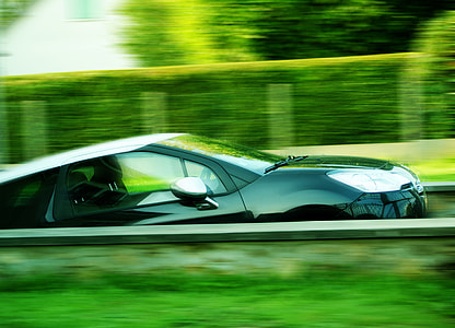 time lapse photo of black coupe thumbnail