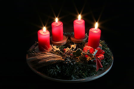 three lighted red pillar candles thumbnail