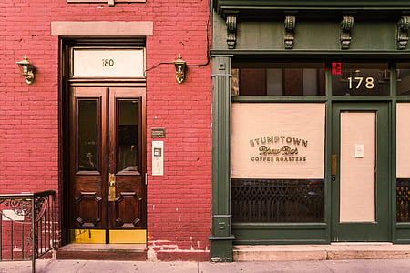 red brick wall building beside green Stumptown cafe thumbnail