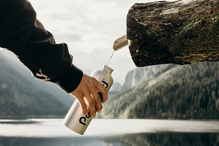 person holding tumbler catching water thumbnail