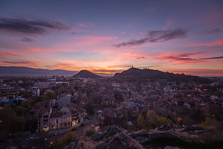 Top View Of Houses And Mountain During Sunset thumbnail