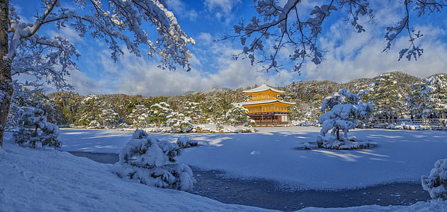 pagoda surrounded with snow covered trees thumbnail