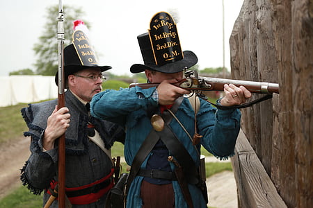 man holding flintlock rifle about to shoot thumbnail