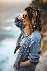 woman wearing blue denim button-up jacket thumbnail