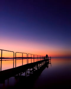 man standing on dock thumbnail