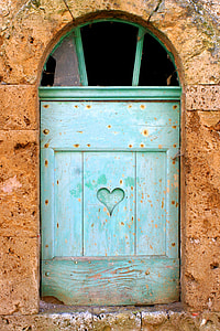 green wooden window pane mounted on brown concrete wal thumbnail