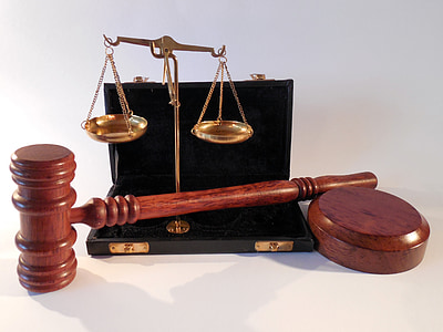 brown mallet beside brown balancing scale thumbnail