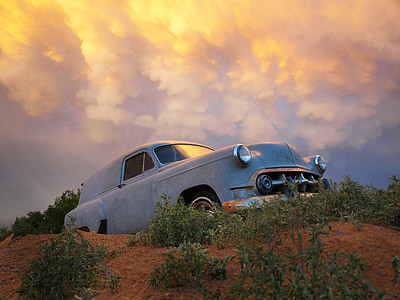 blue car on hill during golden hour thumbnail