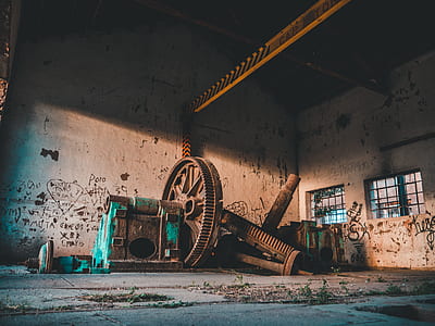 gray metal industrial machine inside concrete building thumbnail