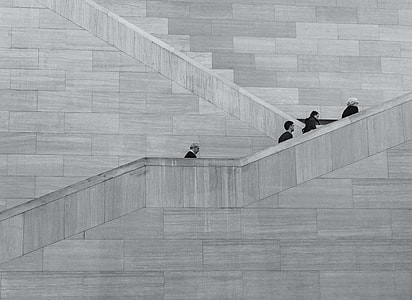 four persons walking on stairs thumbnail