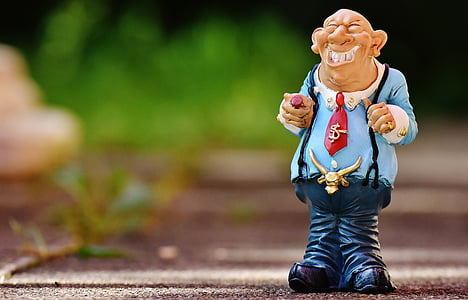 man in blue long-sleeved shirt and dungaree pants figurine thumbnail