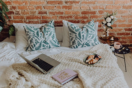 A lovely woman's bedroom with a beautiful bouquet of flowers thumbnail
