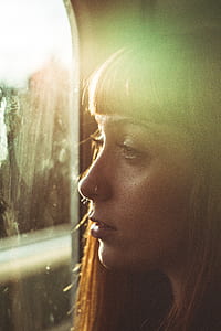 Woman Looking Through a Window thumbnail