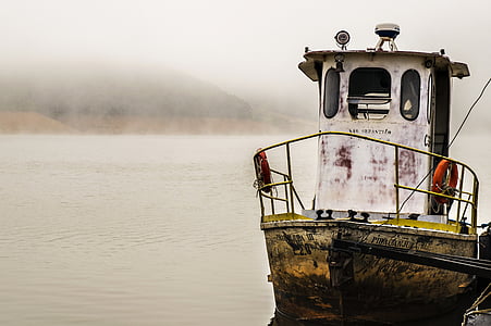 selective photograph of boat parked on shipyard thumbnail