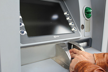 person using ATM machine thumbnail