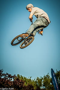low angle photography of man playing BMX bike thumbnail