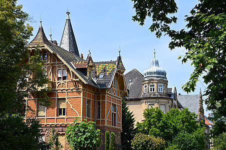 brown concrete castle surrounded with green trees thumbnail