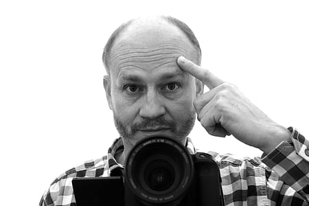 grayscale photo of man pointing hi shead thumbnail