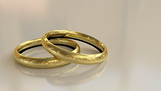 two gold-colored wedding band thumbnail