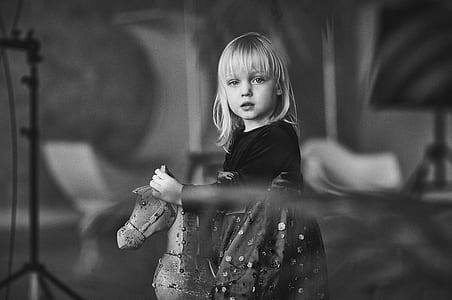grayscale photography of girl riding on horse thumbnail