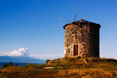 brown concrete shed on grass thumbnail