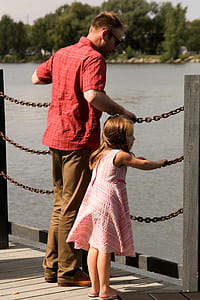 man and girl standing on dock thumbnail