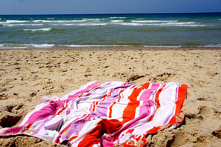 multicolored scarf on seashore thumbnail
