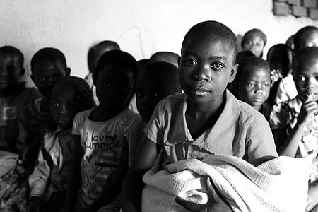 several children gather near wall thumbnail
