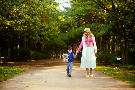 woman and boy walking outdoors thumbnail