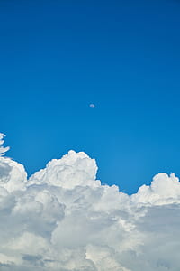white clouds under blud sky thumbnail
