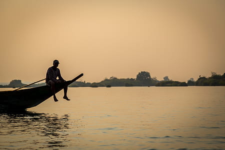 man sitting on boat thumbnail