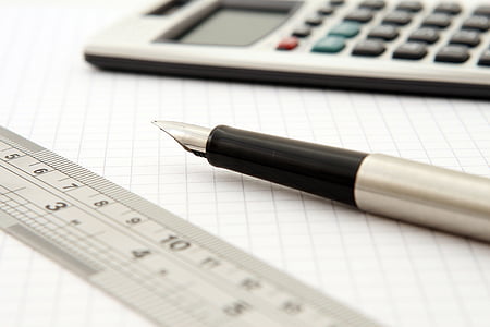 fountain pen between ruler and calculator thumbnail