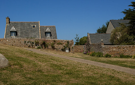 two gray houses on grass field thumbnail