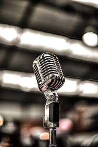 selective focus photography of stage microphone thumbnail