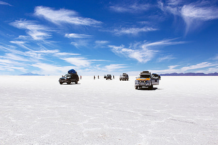 four vehicles on top of ice surface during daytime thumbnail