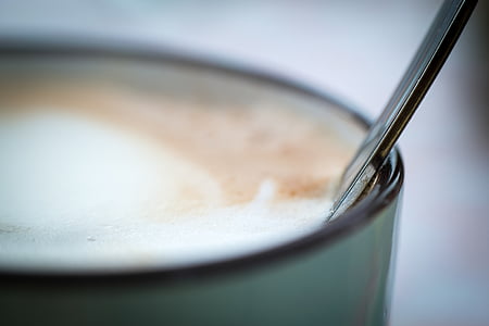 silver utensil in cup of drink thumbnail