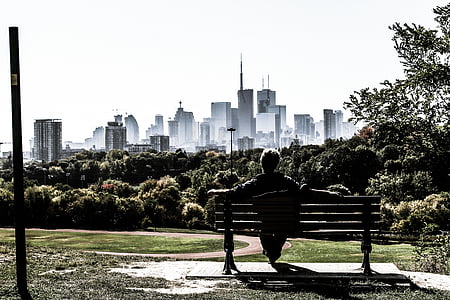 man sitting on outdoor bench thumbnail