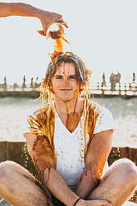 person sitting while smiling in front of the camera thumbnail