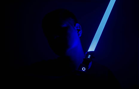 person holding blue lightsaber thumbnail