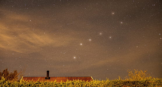photo of red roof house during starry daytime thumbnail